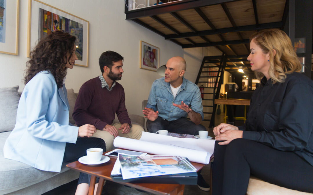 Construction business meeting to discuss marketing a project.